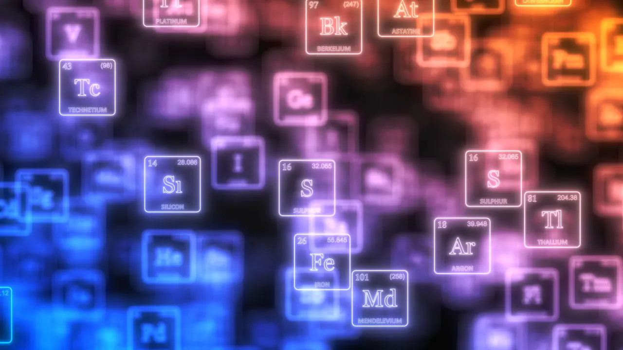 Periodic table element tiles glowing in blue, violet and orange